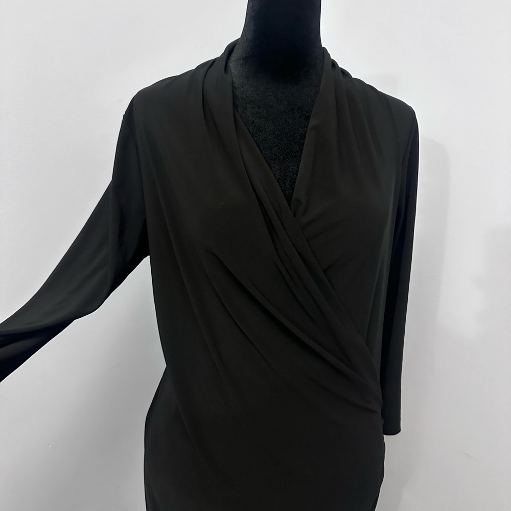 A black dress with cross front and knee length. Very sexy.